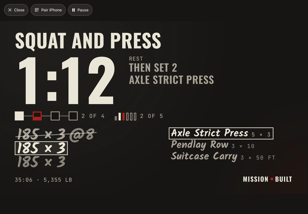 The same moment on an iPad: Axle strict press, a 1:12 rest clock, the next set of 185 × 3 ready, then Pendlay row and suitcase carry.