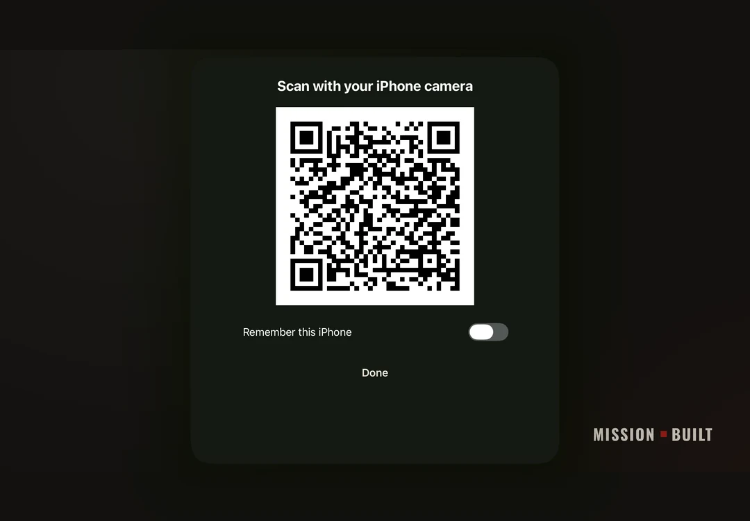 The pairing card on the board: Scan with your iPhone camera, over a QR code, with Remember this iPhone.